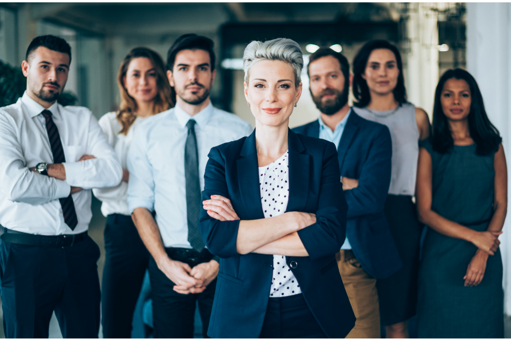 Confident business leader with a professional team